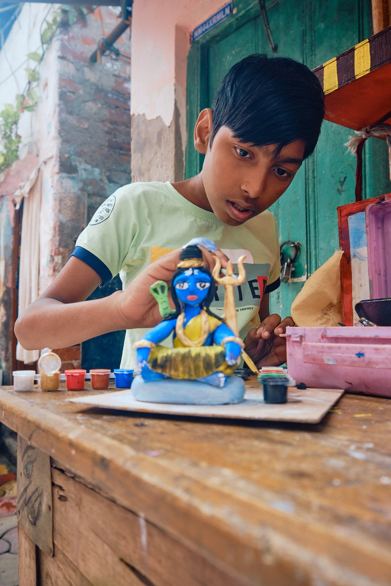 Boy Sculptor Clay Shiva Portrait Kolkata Street Documentary Graphic Color Contrast