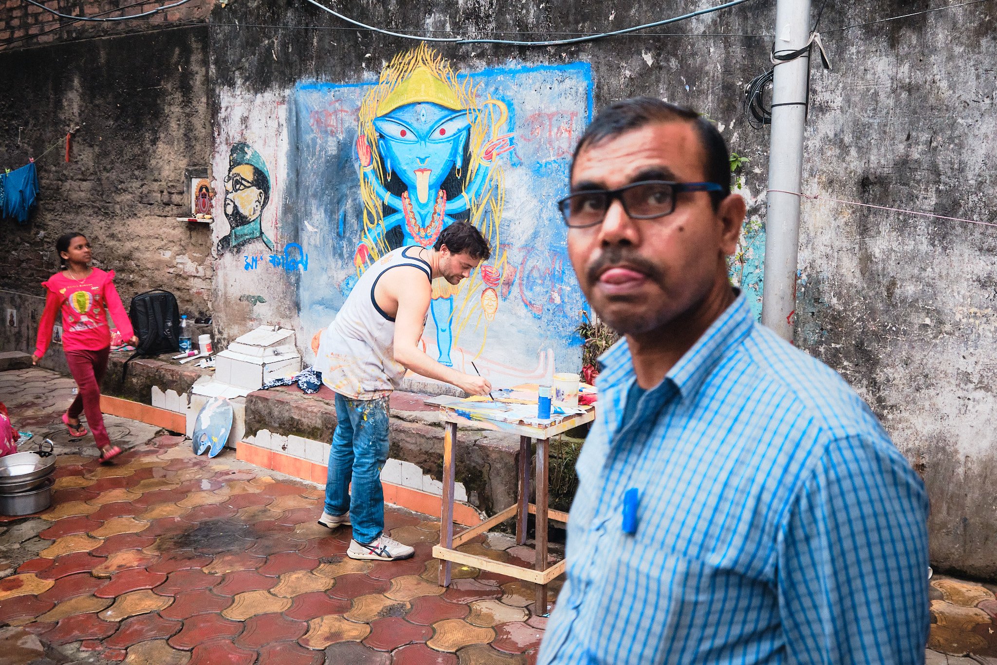 Wall Painting Kolkata India Street Documentary Kali BTS Man Tongue Playful Graphic Color Contrast