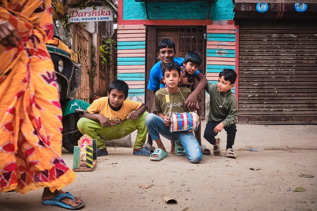 Group Portrait Eyes Kolkata India Street Documentary Kali BTS Graphic Color Sari Playful Ganesha