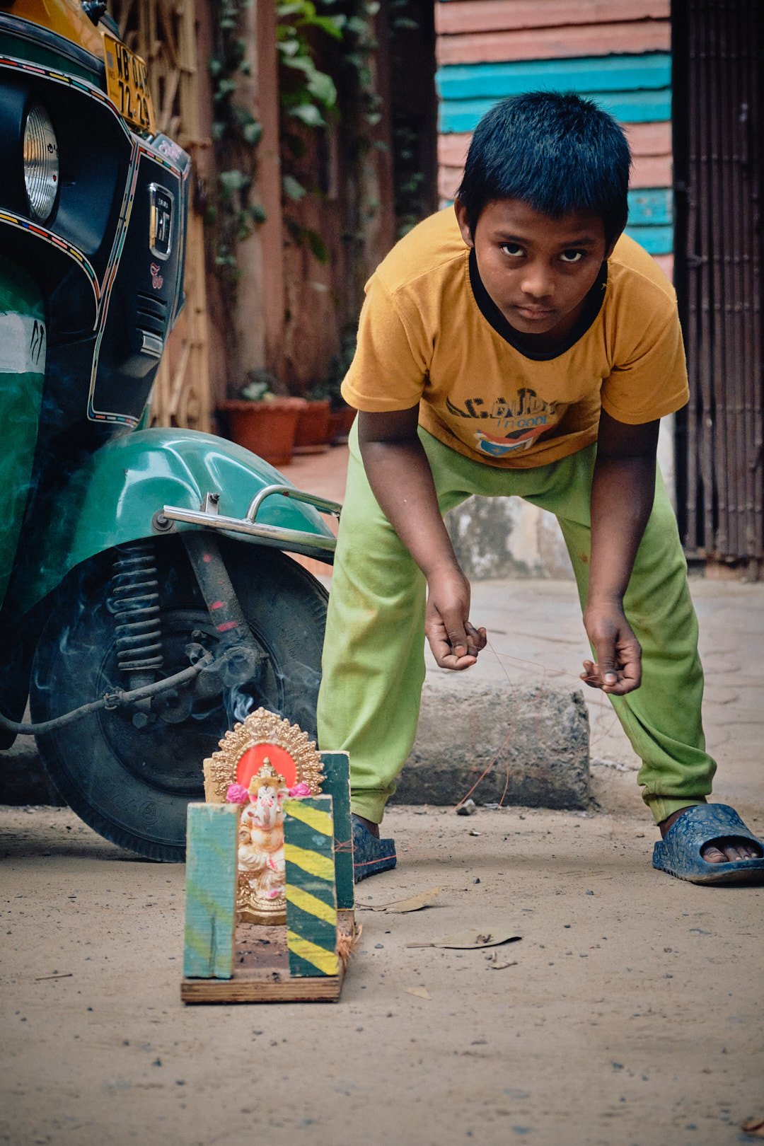 Boy Portrait Eyes Kolkata India Street Documentary Kali BTS Graphic Color Playful Ganesha