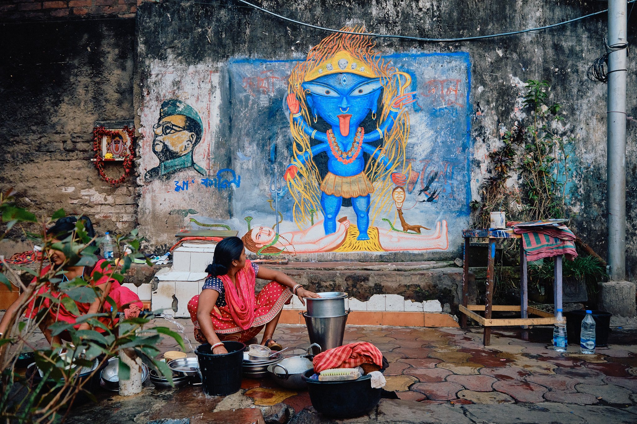 Wall Painting Woman Working Water Kolkata India Street Documentary Kali BTS Graphic Color Contrast
